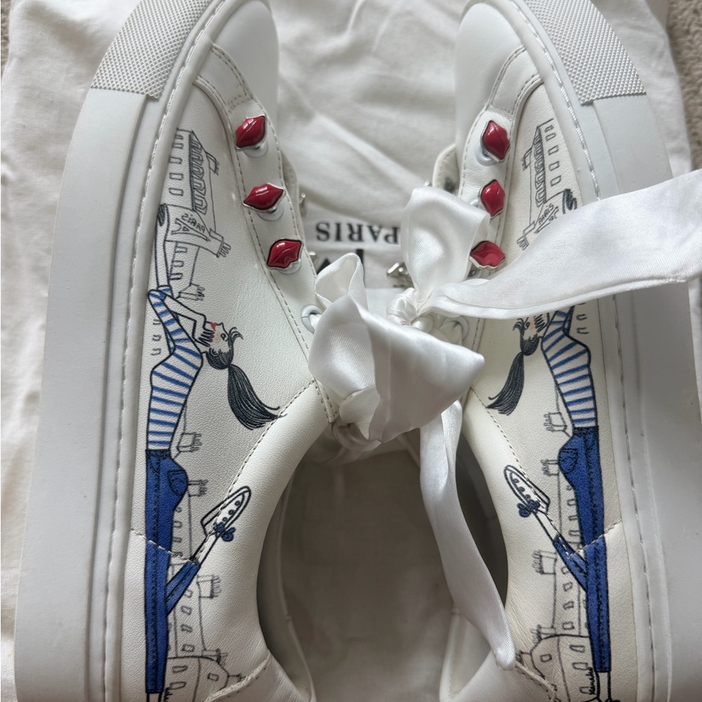 White Sneakers with Blue Illustration and Red Lip Eyelets